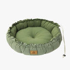 coussin-rond-pour-chien-vert-replie
